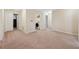 A long hallway with access to bedrooms and laundry at 12307 Duckett Ct, Spring Hill, FL 34610