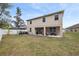 Two-story house with covered patio and fenced backyard at 12307 Duckett Ct, Spring Hill, FL 34610