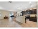 Kitchen with dark cabinets, stainless steel appliances, and an island at 12307 Duckett Ct, Spring Hill, FL 34610