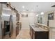 Modern kitchen with stainless steel appliances and granite countertops at 12307 Duckett Ct, Spring Hill, FL 34610