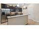 Kitchen features stainless steel appliances and an island at 12307 Duckett Ct, Spring Hill, FL 34610