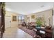 Spacious living room with tiled floors and brown leather furniture at 12307 Duckett Ct, Spring Hill, FL 34610