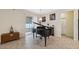 Elegant living room with grand piano and access to backyard at 12307 Duckett Ct, Spring Hill, FL 34610