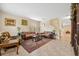 Living room with brown leather sofas, a large TV, and a fireplace at 12307 Duckett Ct, Spring Hill, FL 34610