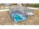 Aerial view showcasing home with screened pool and backyard at 12312 Millington Ave, Weeki Wachee, FL 34614