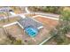 Aerial view showing home, pool, and surrounding landscape at 12312 Millington Ave, Weeki Wachee, FL 34614