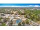 Aerial view showing a house, pool, and surrounding neighborhood at 12312 Millington Ave, Weeki Wachee, FL 34614