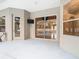 Back patio with sliding doors to pool and lanai, plus exterior door at 12312 Millington Ave, Weeki Wachee, FL 34614
