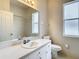 Clean bathroom with single vanity and toilet at 12312 Millington Ave, Weeki Wachee, FL 34614
