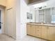 Double vanity bathroom with access to a bedroom at 12312 Millington Ave, Weeki Wachee, FL 34614