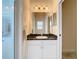 Bathroom with vanity, mirror, and window at 12312 Millington Ave, Weeki Wachee, FL 34614