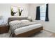 Modern bedroom with a king-size bed and wood flooring at 12312 Millington Ave, Weeki Wachee, FL 34614