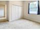 Bedroom with closet and window, neutral wall colors at 12312 Millington Ave, Weeki Wachee, FL 34614