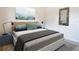 Bright bedroom with a queen-size bed and stylish decor at 12312 Millington Ave, Weeki Wachee, FL 34614