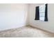 Bright bedroom with neutral walls and carpet at 12312 Millington Ave, Weeki Wachee, FL 34614