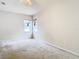 Bright bedroom featuring two windows and ceiling fan at 12312 Millington Ave, Weeki Wachee, FL 34614