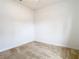 Spacious bedroom with carpeted floors and neutral walls at 12312 Millington Ave, Weeki Wachee, FL 34614