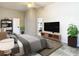 Spacious bedroom with ensuite bathroom and large TV at 12312 Millington Ave, Weeki Wachee, FL 34614