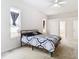 Spacious bedroom with carpeted floors and ceiling fan at 12312 Millington Ave, Weeki Wachee, FL 34614