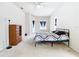 Main bedroom with carpeted floor, ceiling fan, and access to backyard at 12312 Millington Ave, Weeki Wachee, FL 34614