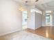 Dining room with carpet and views into kitchen and living areas at 12312 Millington Ave, Weeki Wachee, FL 34614