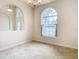 Dining room featuring carpet, chandelier, and views of entryway at 12312 Millington Ave, Weeki Wachee, FL 34614