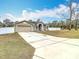 House with long driveway and attached garage at 12312 Millington Ave, Weeki Wachee, FL 34614