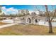 One story house with green door and driveway at 12312 Millington Ave, Weeki Wachee, FL 34614