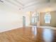 Spacious living room with hardwood floors and entryway views at 12312 Millington Ave, Weeki Wachee, FL 34614