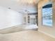 Bright living room with pool view and built-in shelving at 12312 Millington Ave, Weeki Wachee, FL 34614