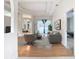 Bright living room with pool view, hardwood floors, and access to the backyard at 12312 Millington Ave, Weeki Wachee, FL 34614