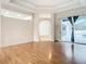 Spacious living room featuring hardwood floors and access to a patio at 12312 Millington Ave, Weeki Wachee, FL 34614