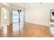 Living room with hardwood floors and sliding doors to pool area at 12312 Millington Ave, Weeki Wachee, FL 34614