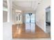 Bright living room with hardwood floors, access to pool, and views of backyard at 12312 Millington Ave, Weeki Wachee, FL 34614
