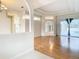 Open living area with hardwood floors and views into other rooms at 12312 Millington Ave, Weeki Wachee, FL 34614