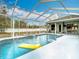 Spacious screened pool and spa with plenty of room for fun at 12312 Millington Ave, Weeki Wachee, FL 34614