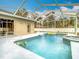 Enjoy this beautiful screened pool and spa in your backyard at 12312 Millington Ave, Weeki Wachee, FL 34614