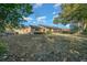 Spacious backyard with mature trees and a large screened porch at 1318 Altoona Ave, Spring Hill, FL 34609