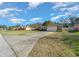 Single-story home with a long driveway at 1318 Altoona Ave, Spring Hill, FL 34609