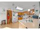 Kitchen with wood cabinets, white appliances, and tile flooring at 1318 Altoona Ave, Spring Hill, FL 34609
