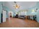 Living room with tile floors, comfy seating, and view to entryway at 1318 Altoona Ave, Spring Hill, FL 34609