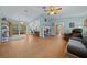Spacious living room with tile floors and access to kitchen and other rooms at 1318 Altoona Ave, Spring Hill, FL 34609