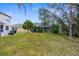 Private backyard with screened-in pool and lush landscaping at 13468 Haverhill Dr, Spring Hill, FL 34609
