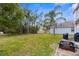 Spacious backyard with fire pit and plenty of green space at 13468 Haverhill Dr, Spring Hill, FL 34609