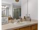 Bathroom vanity with sink and large mirror at 13468 Haverhill Dr, Spring Hill, FL 34609