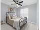 Cozy bedroom with metal bed frame and neutral color scheme at 13468 Haverhill Dr, Spring Hill, FL 34609