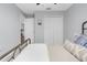 Bedroom with double doors leading to the upstairs hallway at 13468 Haverhill Dr, Spring Hill, FL 34609