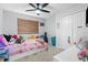 Girly bedroom with flamingo bedding and lots of stuffed animals at 13468 Haverhill Dr, Spring Hill, FL 34609