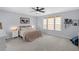 Spacious primary bedroom with carpeted floors and large windows at 13468 Haverhill Dr, Spring Hill, FL 34609