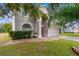 Two-story house with landscaping and a partial view of the driveway at 13468 Haverhill Dr, Spring Hill, FL 34609